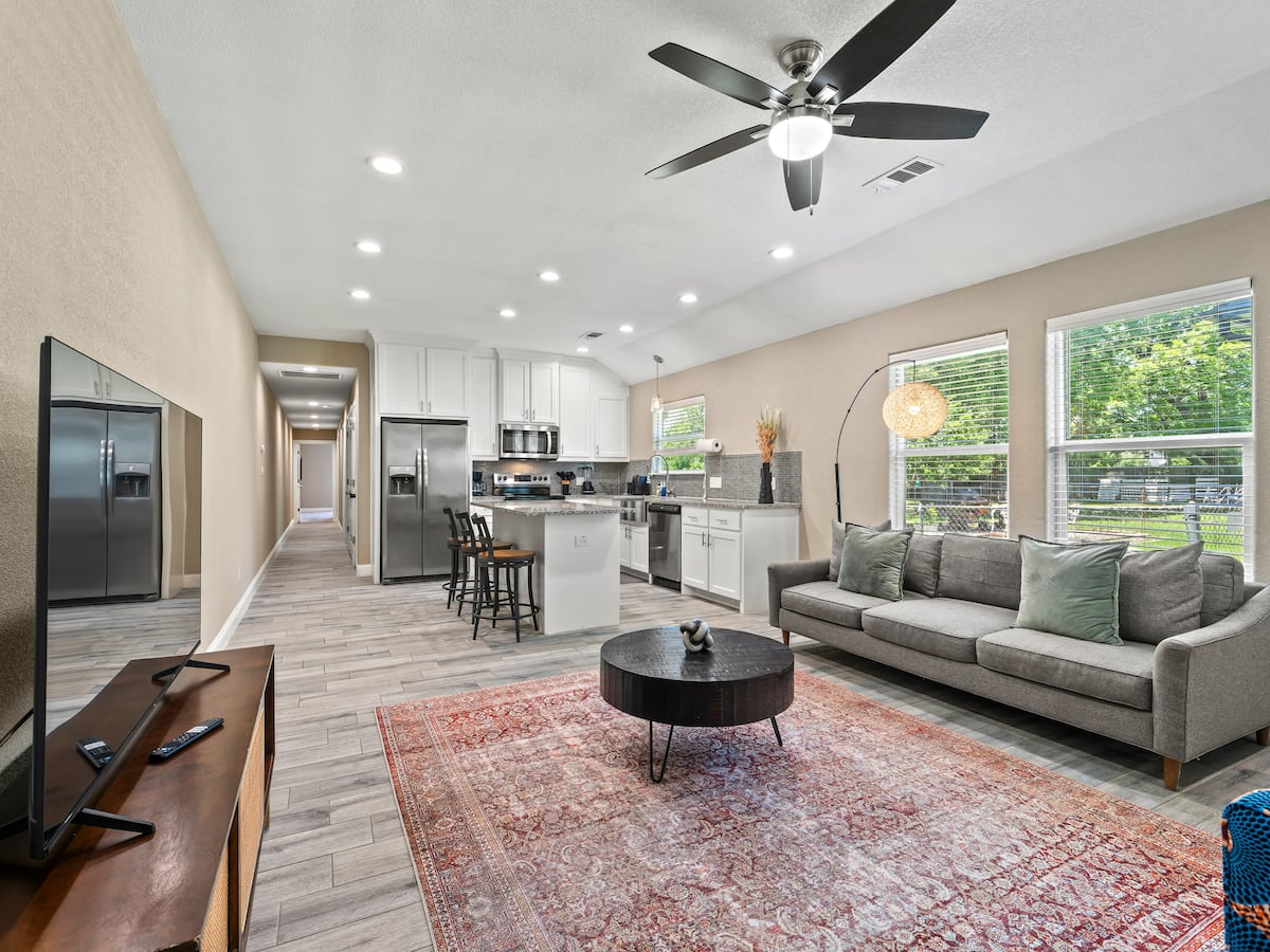 Open-concept living and kitchen area in an MHousing Stays-managed home in Sherman, Texas